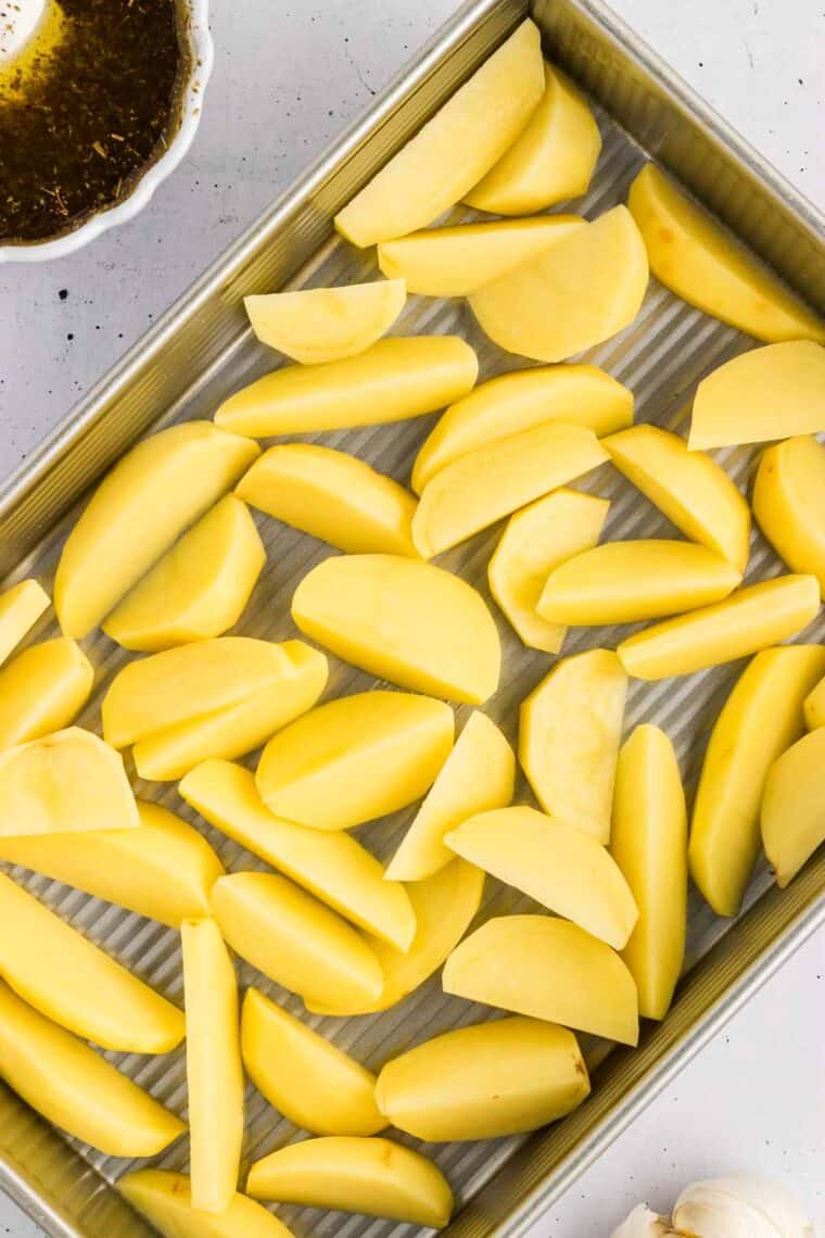 Potato wedges in a baking pan