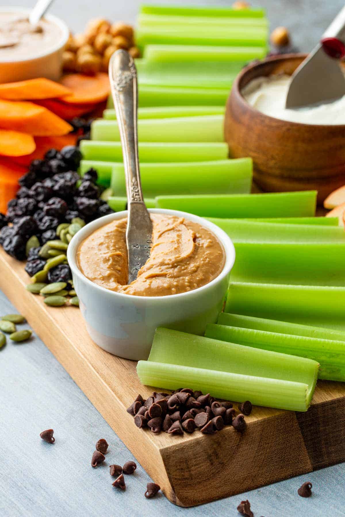 A close up of the celery and peanut butter on an ants on a log snack platter.