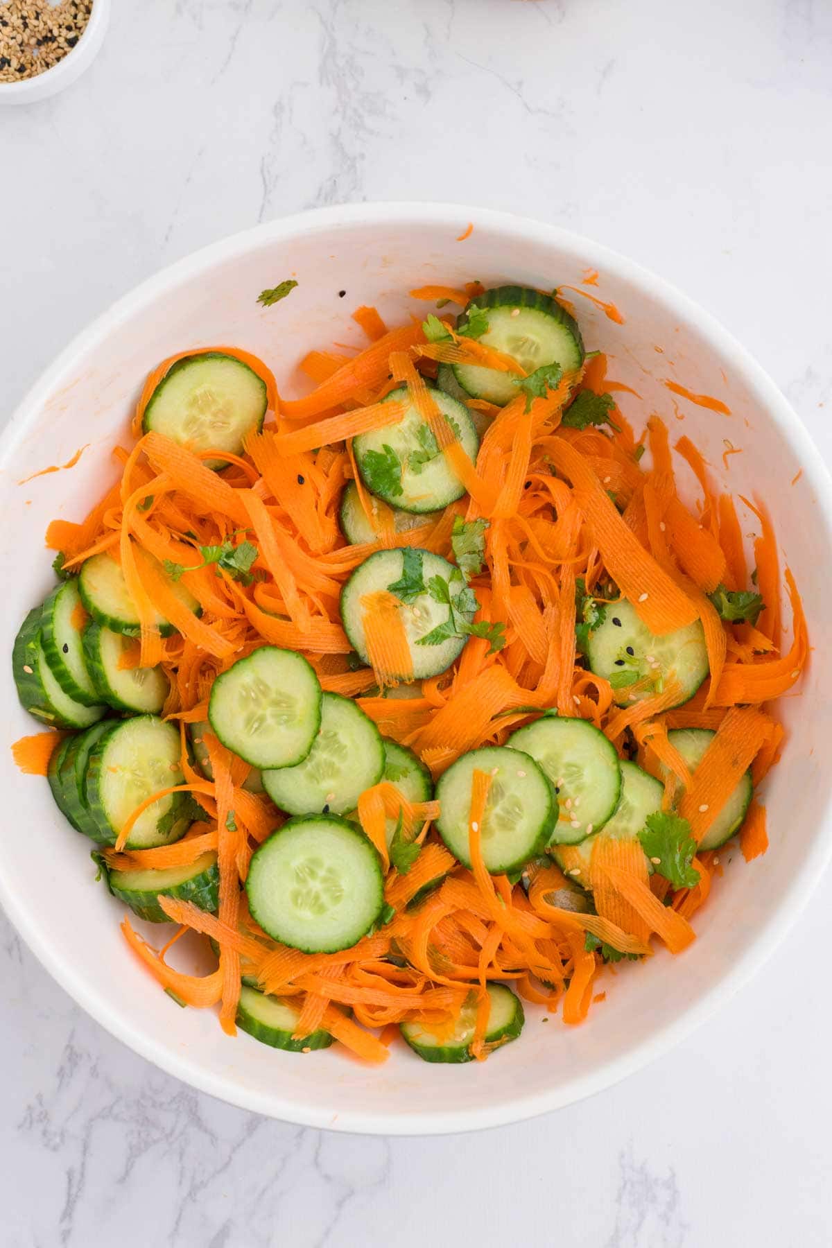 Asian carrot cucumber salad in a bowl
