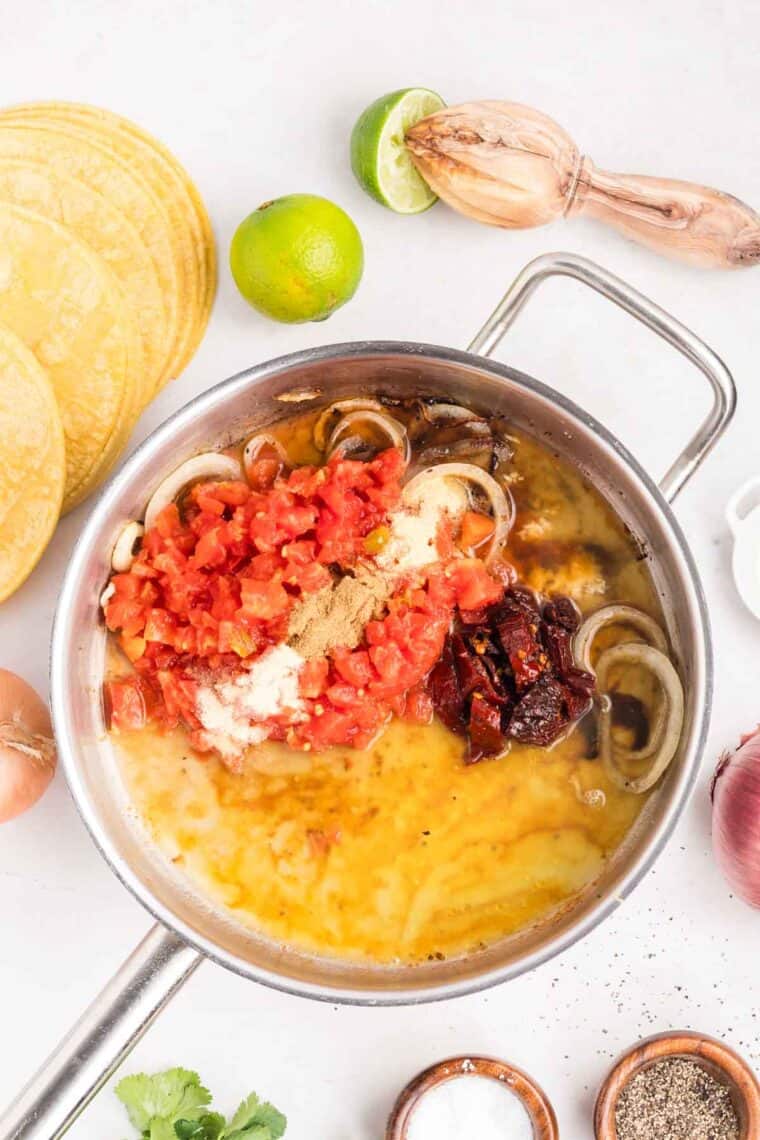 Sauce ingredients added on top of the onions