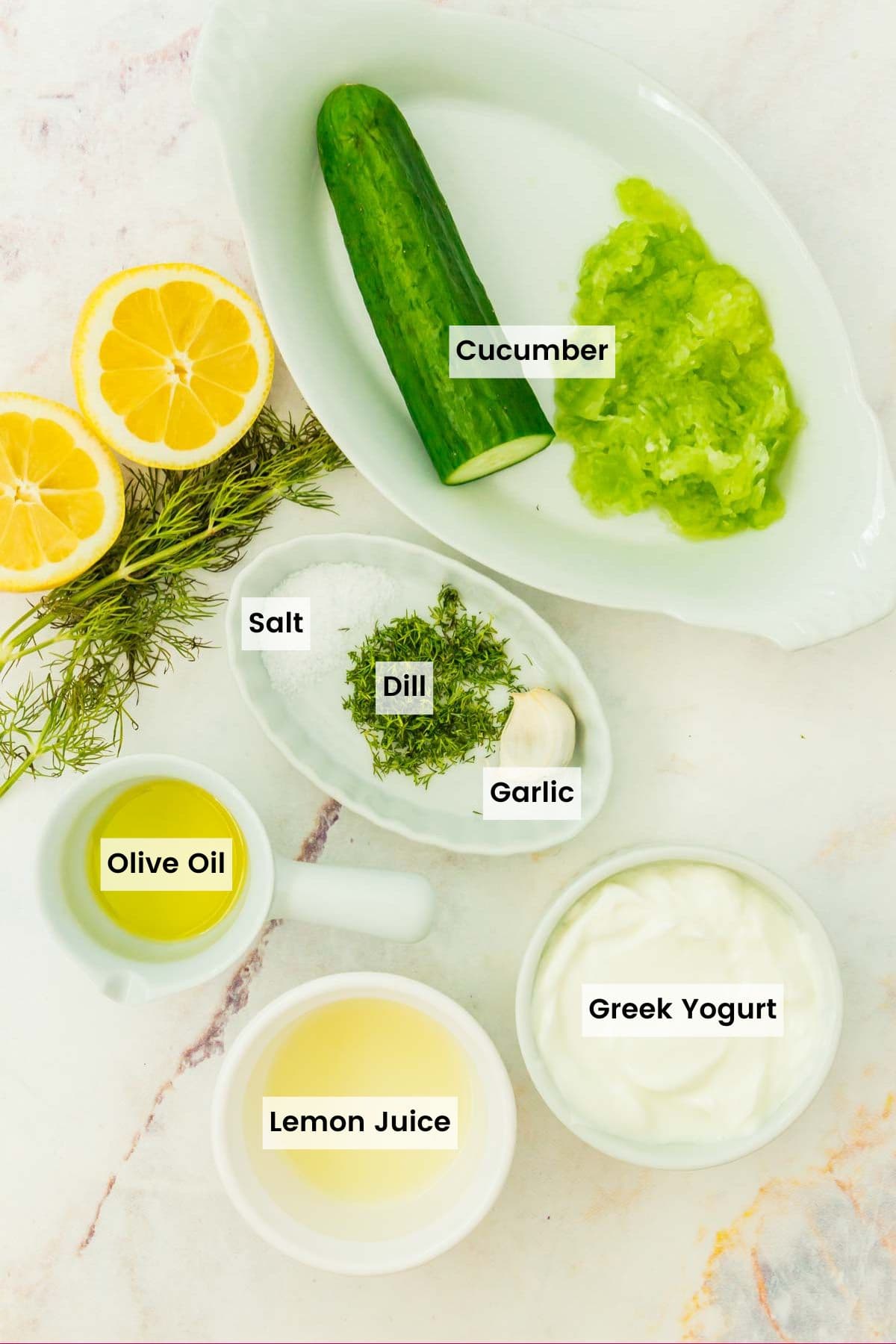 Ingredients to make tzatziki sauce with text labels.
