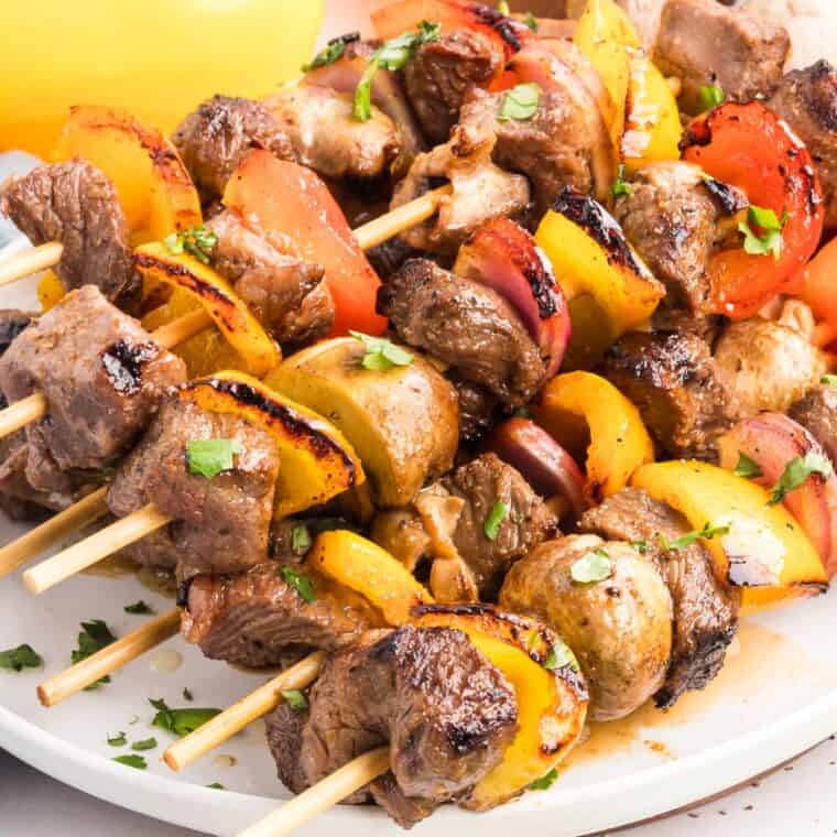 Beef kebabs on a white plate