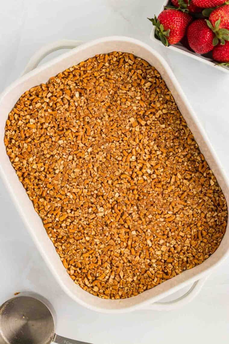 Pretzel crust pressed into the bottom of a baking dish