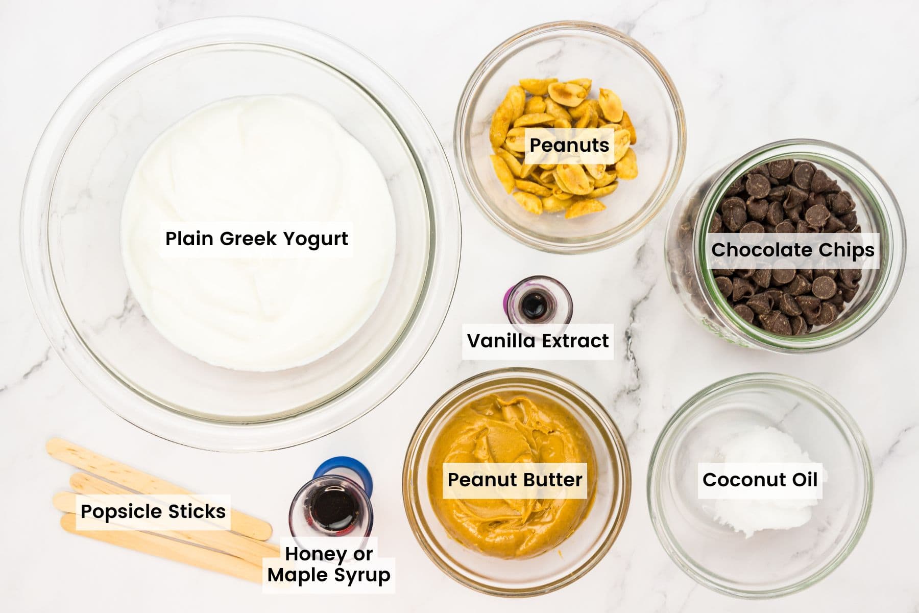 Ingredients for peanut butter frozen yogurt bars are portioned and labelled.