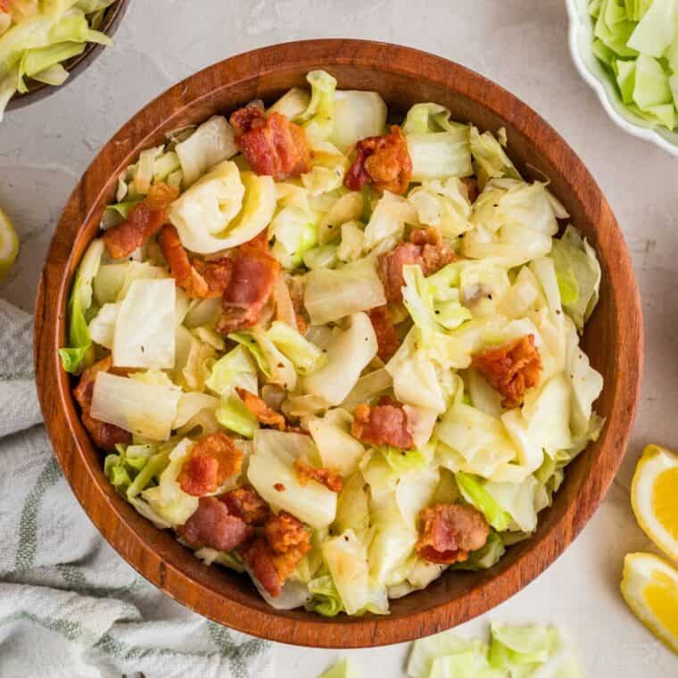 Overhead view of a bowl of fried cabbage with bacon