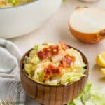 Overhead view of a bowl of fried cabbage with bacon