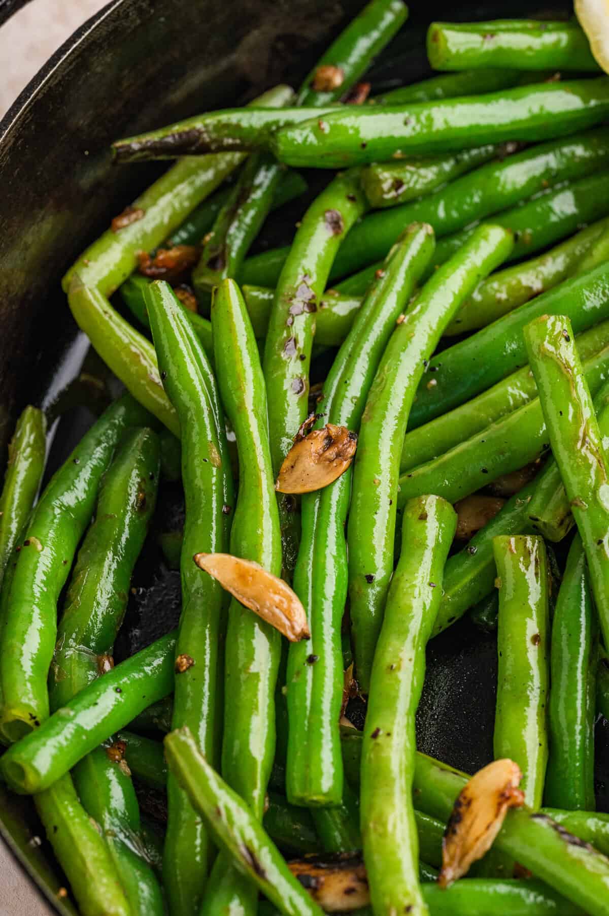 Close up of garlic green beans in the skillet