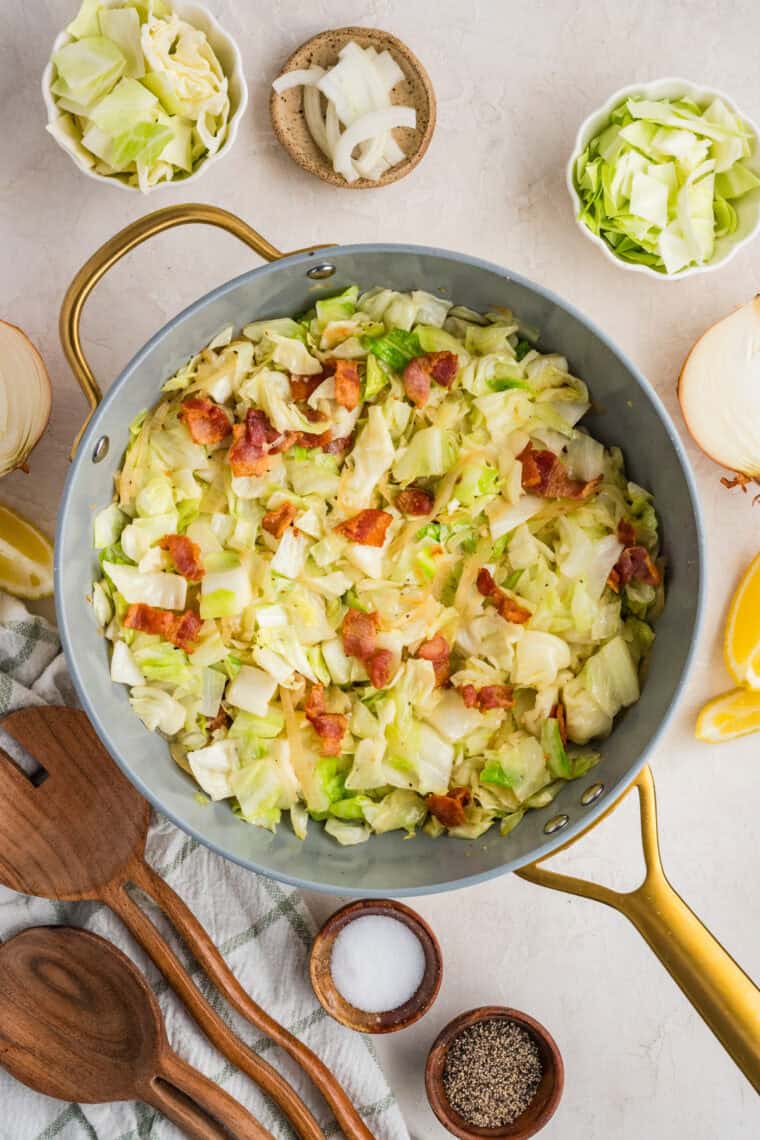 This easy Fried Cabbage recipe turns a handful of ingredients into a savory side dish perfect for busy weeknights & potlucks. Fried cabbage and bacon in a skillet