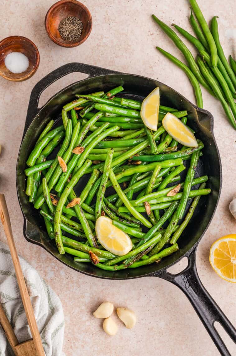 Overhead view of a skillet of garlic green beans