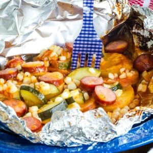 A fork in a Cheesy Sausage Foil Pack Dinner.