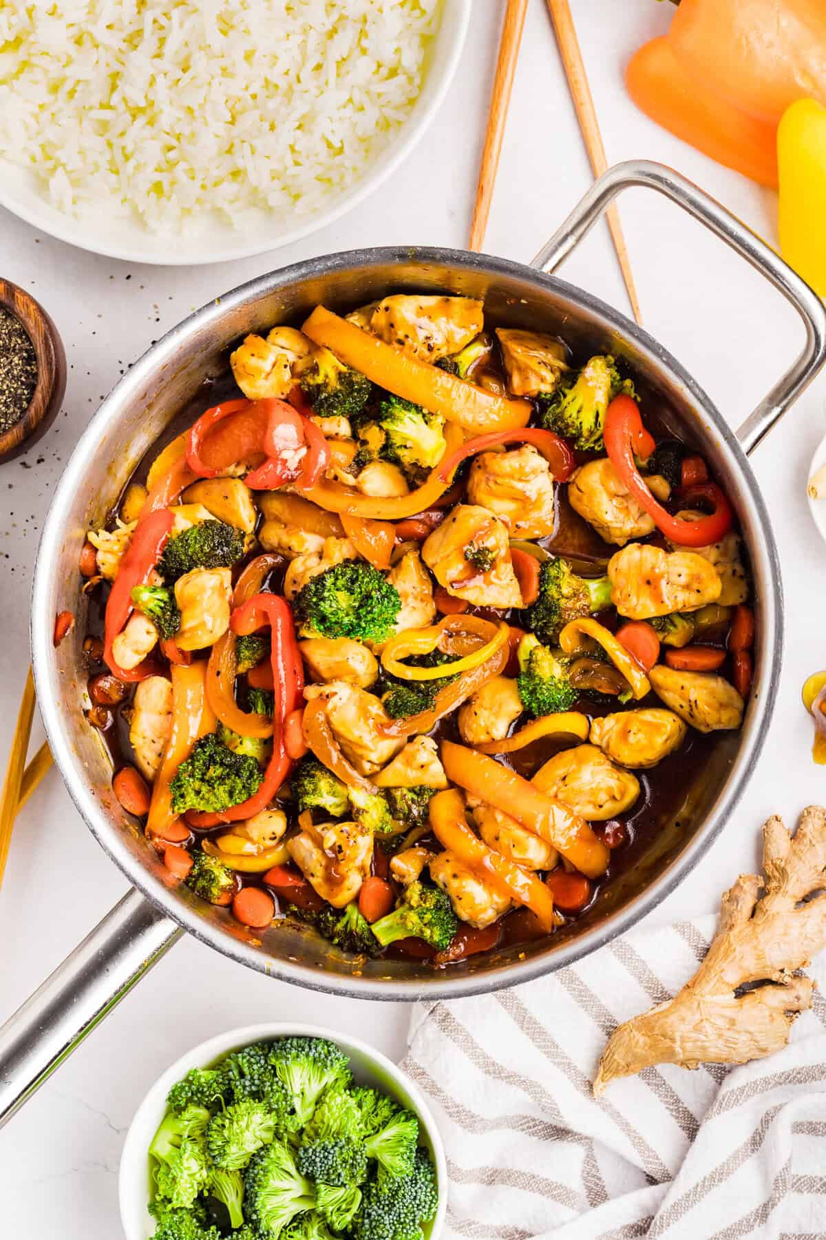 Overhead view of chicken and veggie stir fry in a pan