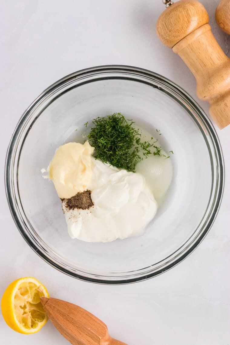 Greek yogurt, mayo, lemon juice, and dill in a bowl