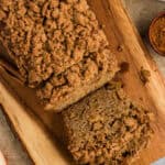 Overhead view of a loaf of gluten free apple bread on a cutting board