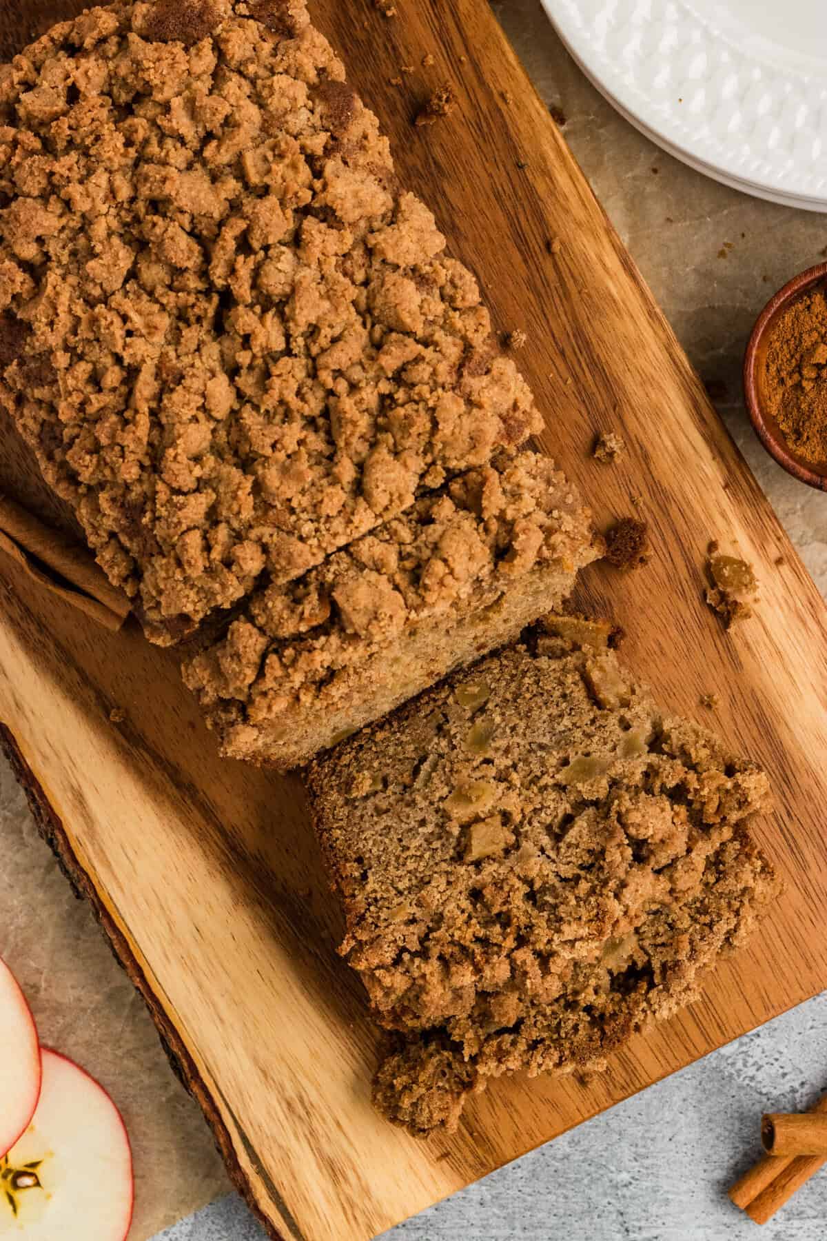 Overhead view of a loaf of gluten free apple bread on a cutting board