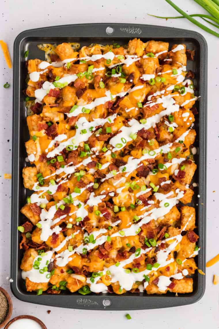 Loaded tater tots on a baking dish
