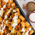 Overhead view of a pan of loaded tater tots