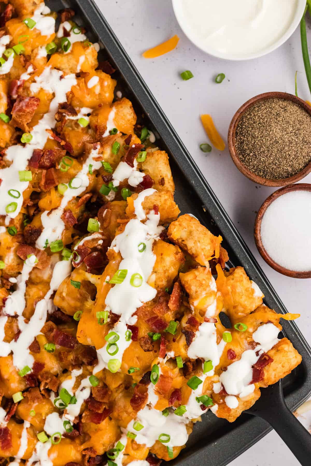 Overhead view of a pan of loaded tater tots