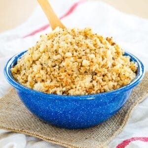 A cauliflower rice side dish in a blue bowl.