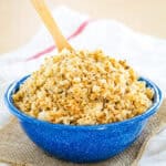 A bowl of cauli rice on top of napkins.