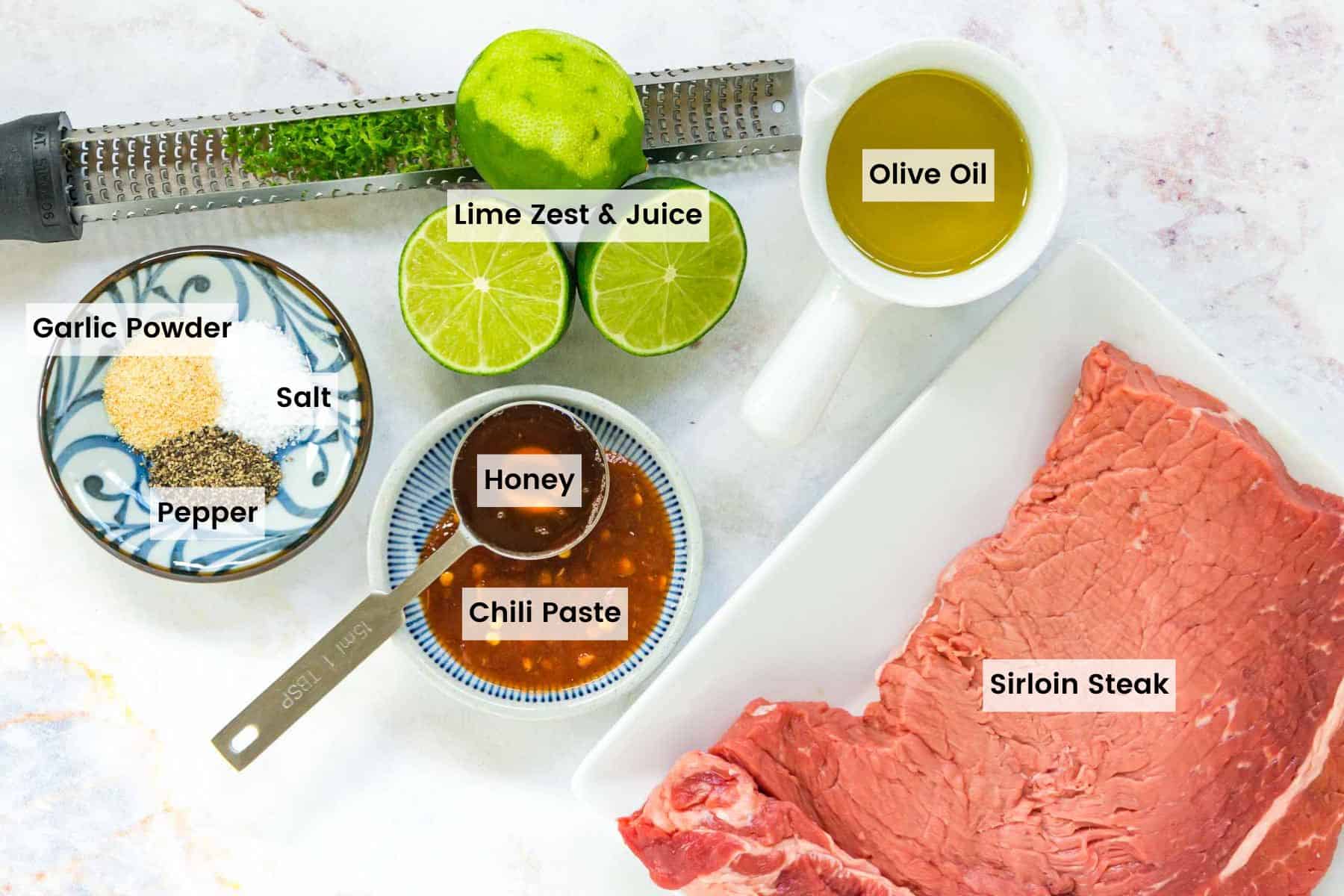 Labeled ingredients for making chili lime steak bites.