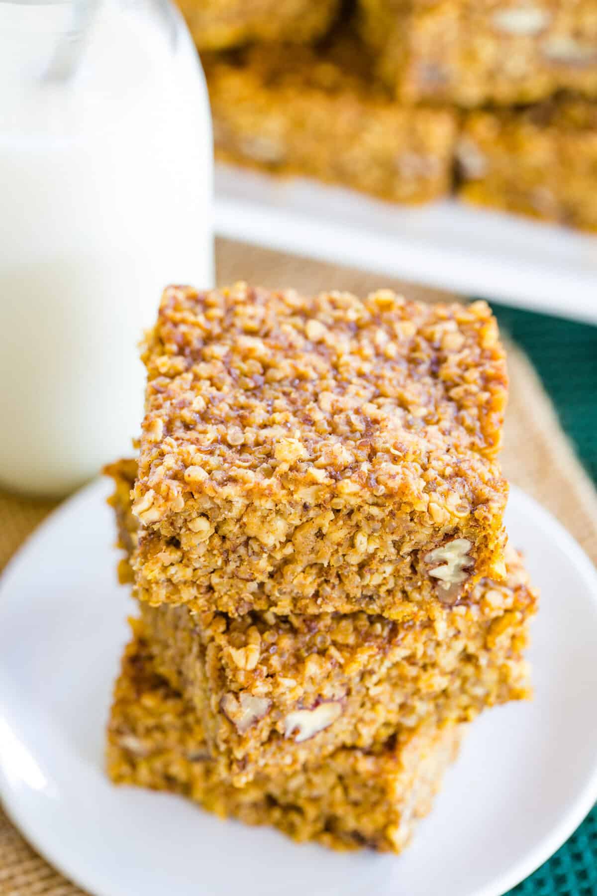 A closeup of the top of a stack of gluten free pumpkin breakfast bars.