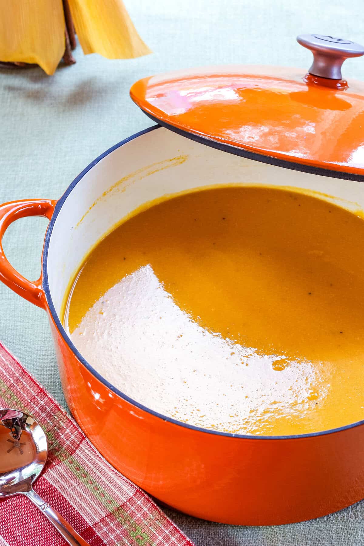 A pot of cheesy butternut squash soup.