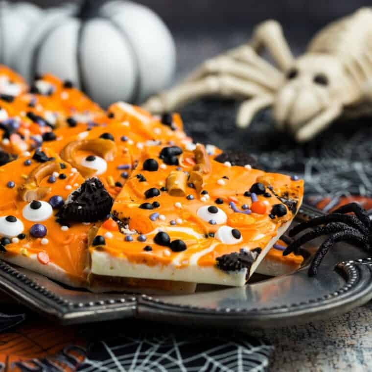 Gluten free Halloween bark on a black plate.