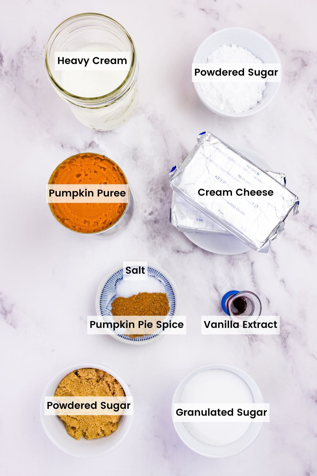 With a graham cracker crust and fluffy pumpkin filling, this gluten free no-bake pumpkin cheesecake is an easy fall dessert. Overhead view of ingredients to make no bake pumpkin cheesecake