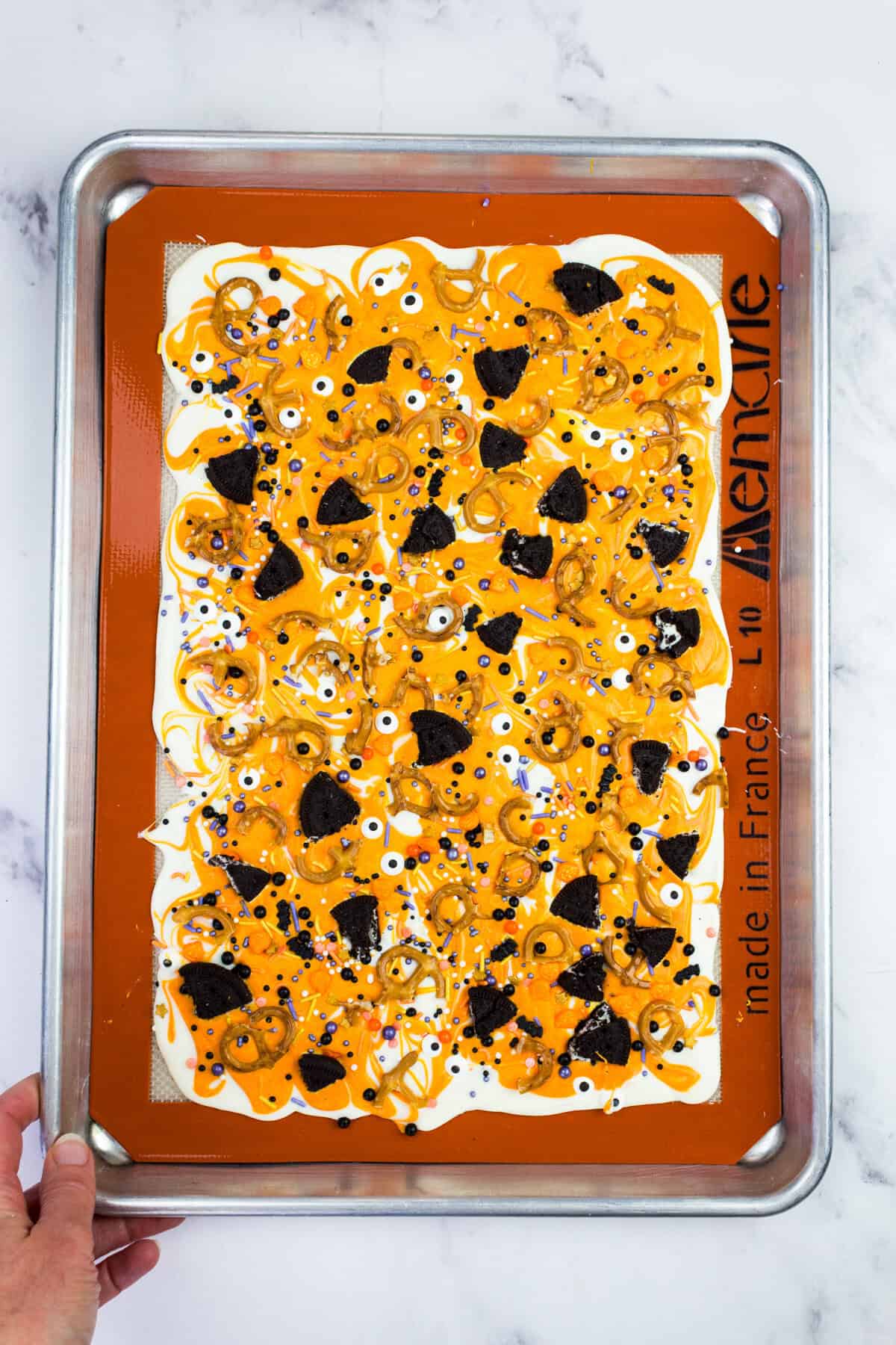 Overhead view of Halloween bark on a baking sheet